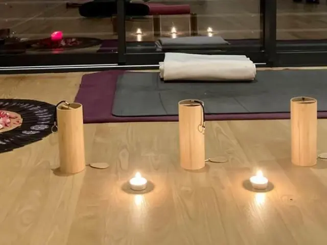 Yoga ceremony with candles and accessories