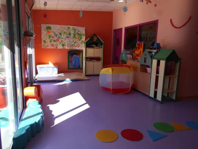 Children's playroom with colorful toys and furniture